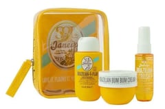 a yellow bag with a small bag of cream and a bottle of cream