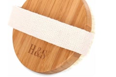 a wooden board with a white ribbon around it
