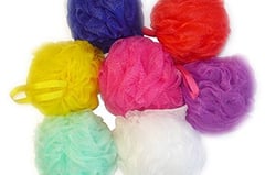 a bunch of colored balls of soap on a white background