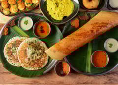 Traditional South Indian cuisine by Zayka Caterers, featuring Uttapam, dosa, sambar, and chutney.