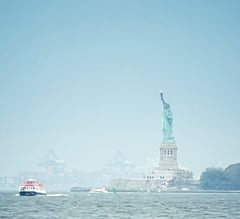 Staten Island ferry sailing past the statue of liberty