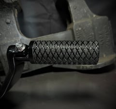 black motorcycle peg with deep knurling and diamond pattern