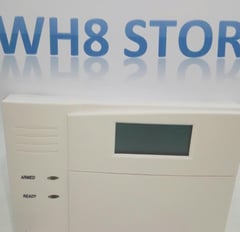 a white and blue alarm clock with the words wh8 store on it sistem alarm keamanan 
