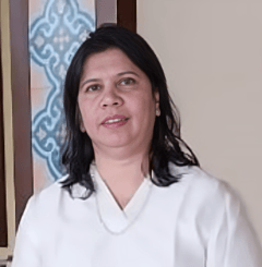 a woman in a white shirt and a blue and white wall