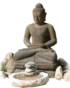 a statue of a buddha statue in a garden