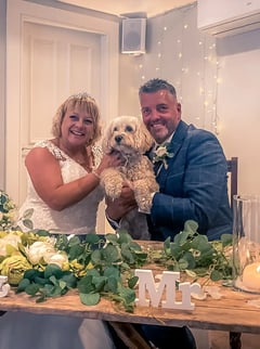 Couple With Their Dog At The end Of Their Ceremony