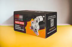 Corrugated folding carton for starter motor