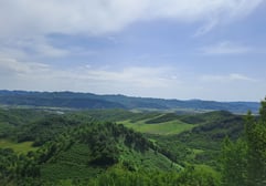a view of a mountain range with a bench and a bench