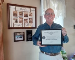 Daniel Bean holding Life Coach Certificate