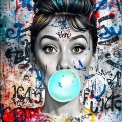 Audrey Hedpburh with a bubblegum