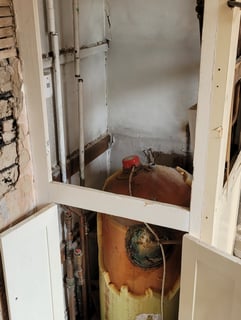 Old gravity-fed heating system before conversion in Skegness
