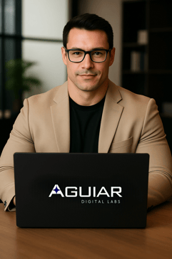 a man consultant and specialist Aguiar Digital Labs in a suit and glasses sitting at a table