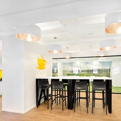 view of kitchen with high stools and tables