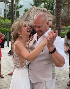 a man and woman dancing at a wedding