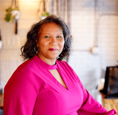 pastor dezi berry in fuschia dress