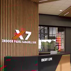 Padel X7 Sabadell club reception area with lunge and check-in desk