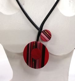 a necklace with a red and black striped necklace