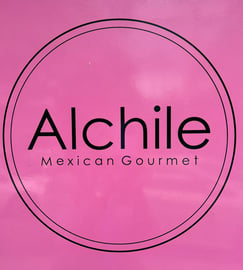 a pink box with Alchile Mexican Gourmet sign