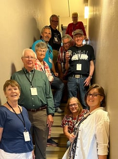 10 telelaget members stand in a stairwell