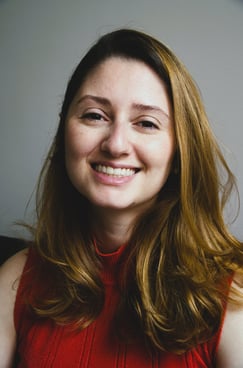 a woman with long hair and a red dress