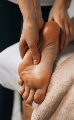 a person is getting a foot massage