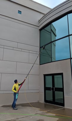 Cleaning windows of a commercial business with a five stage filtration water pool 