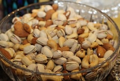 a bowl of nuts and nuts in a glass bowl