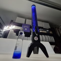 Blue glowing drink tower with ice cube tube, on a glow bar with lets glow neon behind in Redlands.