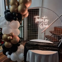 Circle mesh backdrop with cake table and twenty one neon at Kaea's 21st in Burpengary.