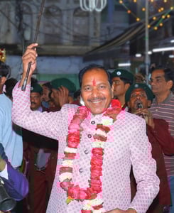 The owner of Manohar Brass Band mastering the band group during a live session.