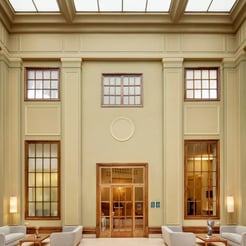 Modern hotel lobby with comfortable seating near Barcelona padel camp
