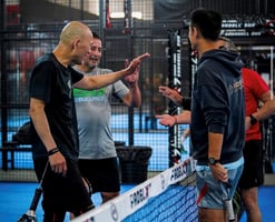 Group of players showing sportsmanship after a padel match