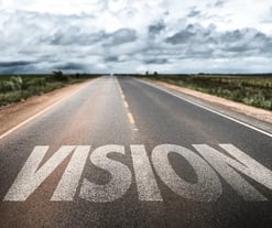 a road with the word vision written on it