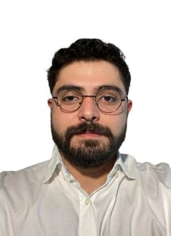a man with a beard and glasses on his head