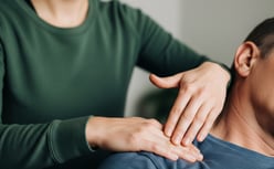 Certified instructor demonstrating hands-on vibrational energy healing techniques for chakra balanci