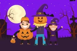 three children dressed in costumes for halloween