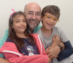 a man and two children posing for a picture