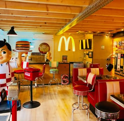 a statue of a man holding a hamburger burger king,burger king sign