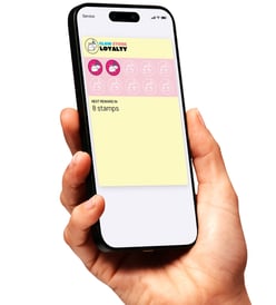 Phone with Claw Store loyalty card on screen