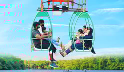 a man and woman sitting on a chair in a chair