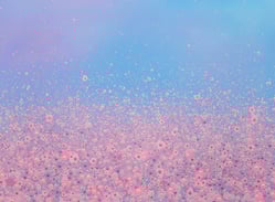 a pink and blue sky with lots of bubbles in the air