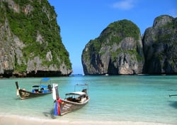 a couple of boats are parked in an island