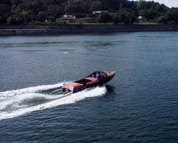 Guests enjoying a James Bond–style ride on Eskrok, a classic speedboat on the Douro River