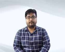"Expert male tutor from Excellence Home Tuition standing confidently, ready to teach."