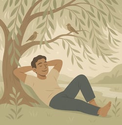 a man sitting calm below a tree in a park