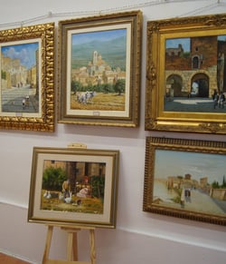 a wall of paintings of paintings of paintings of paintings of people