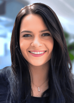 a woman with long hair and a black top