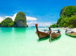 two boats are parked in the water