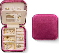 a jewelry box with a pink velvet case