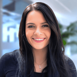 a woman with long hair and a black top